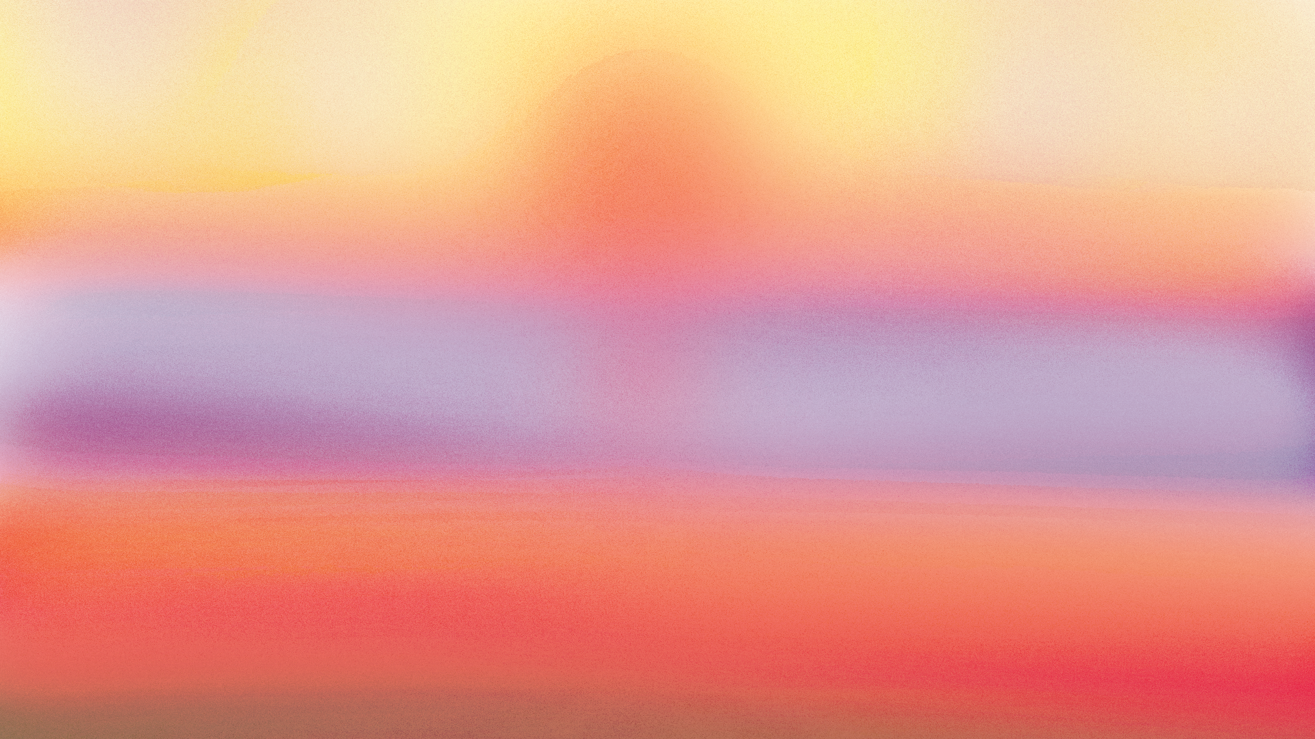 Soft abstract gradient displaying horizontal bands of orange, yellow, purple, and red.